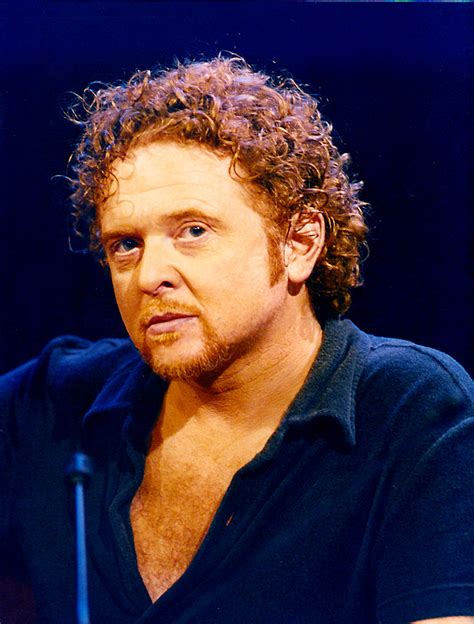 how old is the lead singer of simply red
